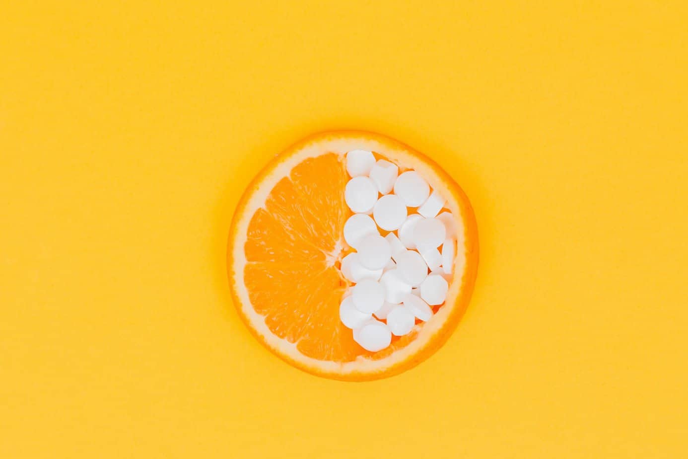 orange fruit slices on yellow surface